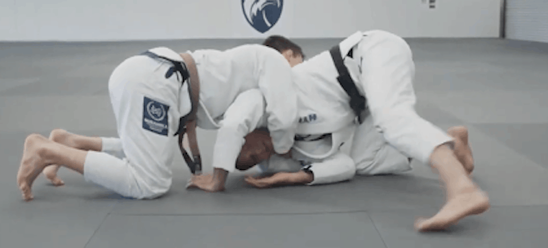to-start-your-escape-from-the-darce-choke-post-your-left-hand-on-the-mat-to-relieve-pressure-from-the-darce-choke