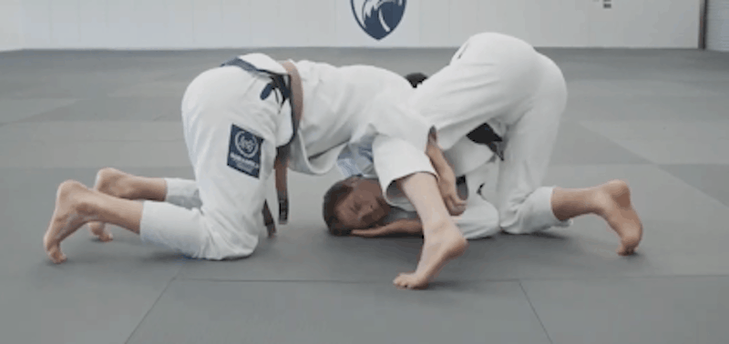 now-to-escape-the-darce-choke-wrap-your-left-arm-around-your-own-leg-to-stop-your-opponent-from-adjusting-the-darce-choke